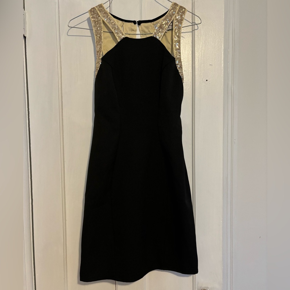 Black dress with gold sequin straps
